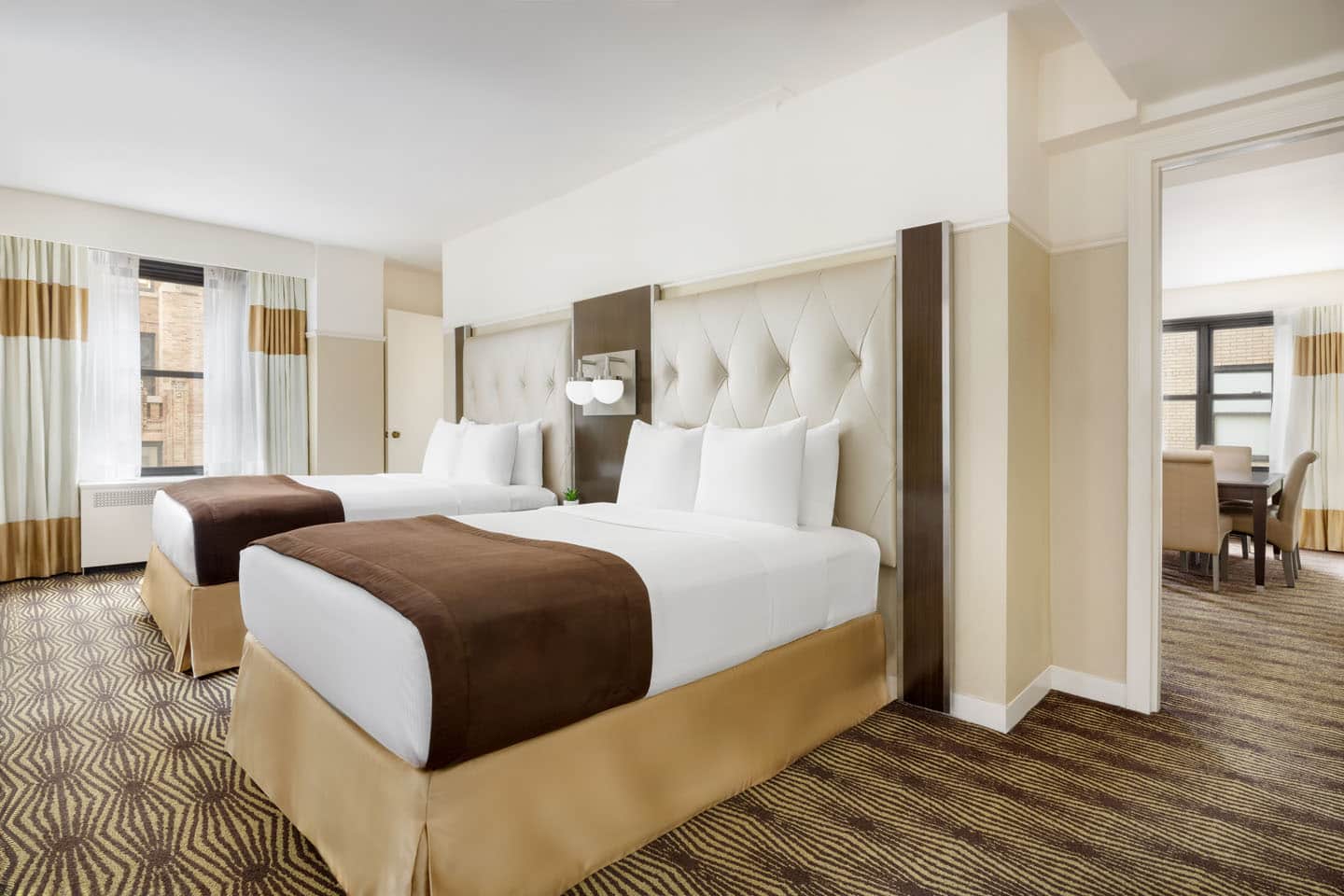 double room with double twin beds large windows and view of nyc