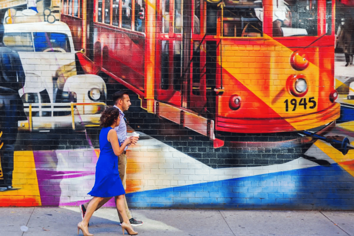 woman and man walking down street