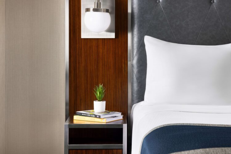 executive queen nightstand with decorations such as plant pot and lighting