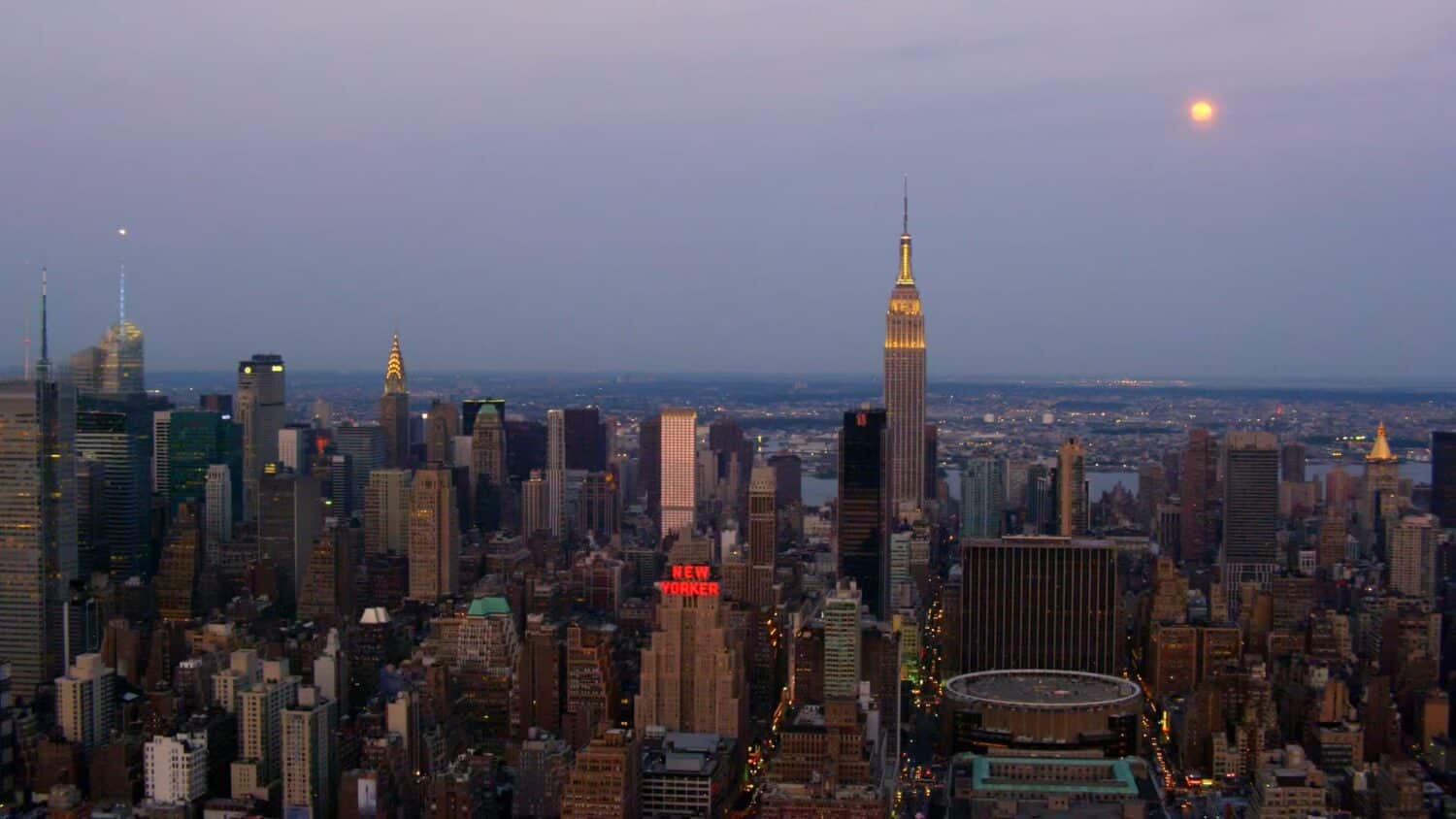 New York skyline featuring the new yorker at sunset
