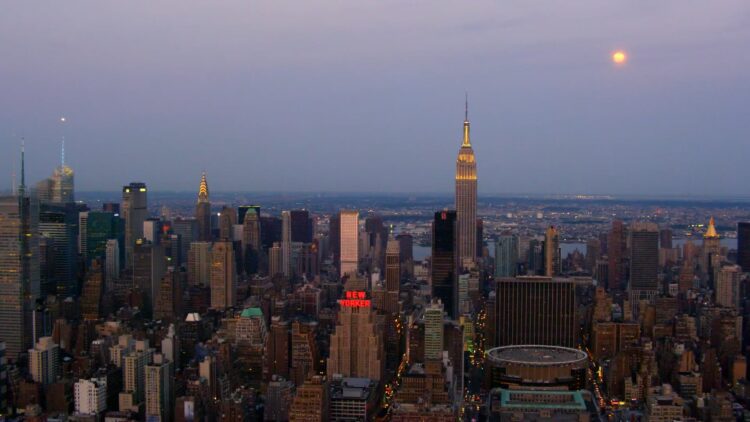 New York skyline featuring the new yorker at sunset