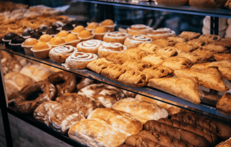 new york bakery with pastries, doughnuts, croissants and sweet treats in glass case