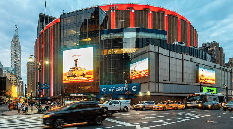 city view of madison square garden with empire state building behind