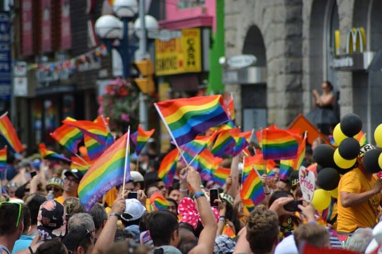 NYC Pride march with pride flags on the streets
